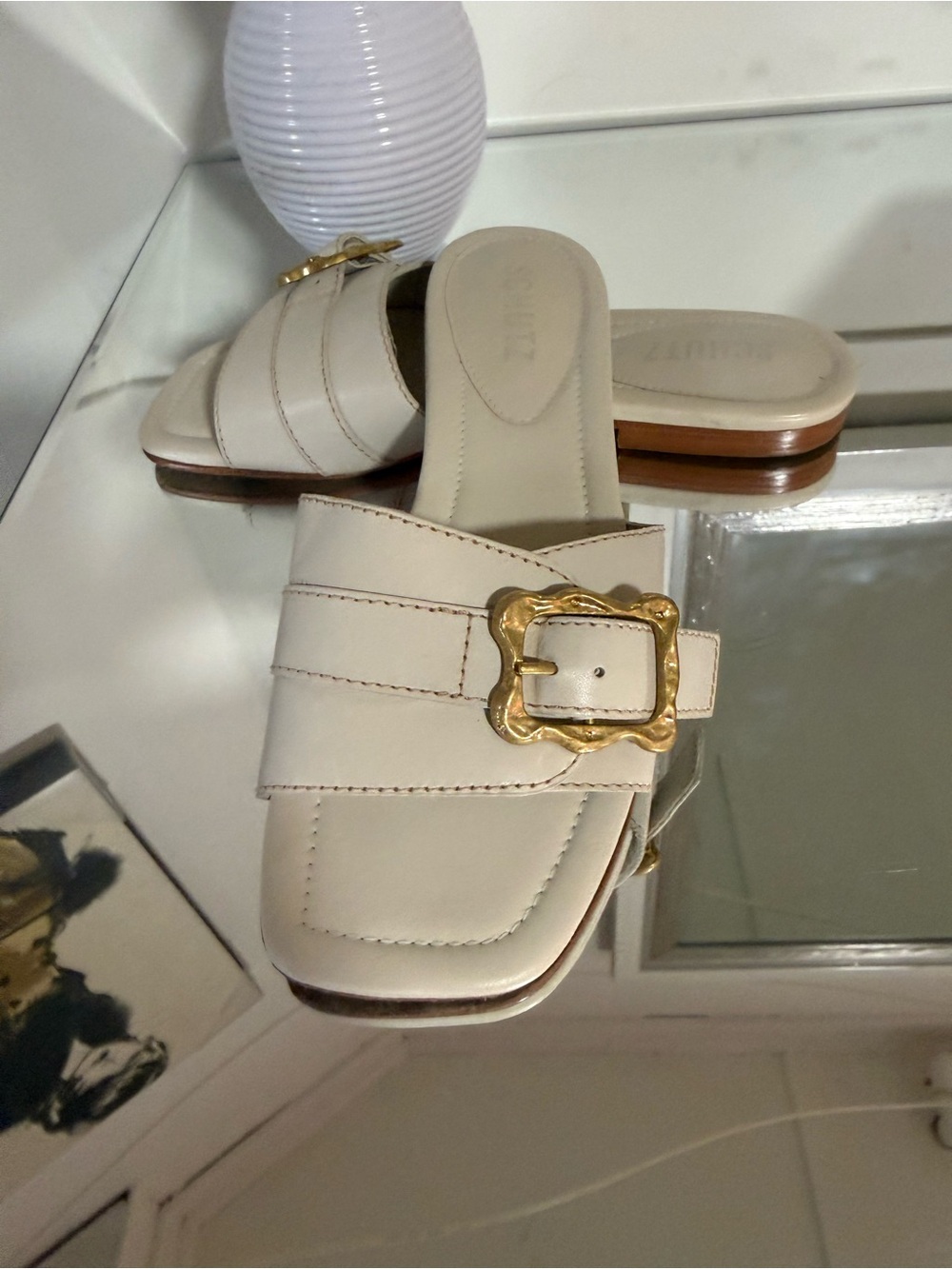 SCHUTZ Cream Leather Slide Mules with Decorative Gold Buckle